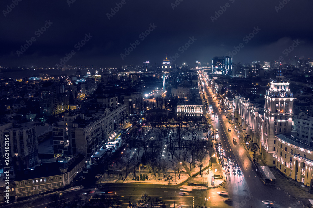 Arial view of night city Voronezh, evening cityscape with roads, parks and traffic, drone shot