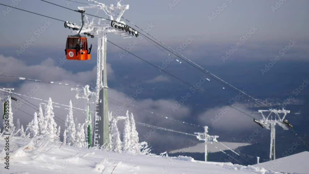 Beautiful winter mountains panorama with ski slope and ski lift. slow motion. 3840x2160 Beautiful winter mountains panorama with ski slope and ski lift. slow motion. 3840x2160