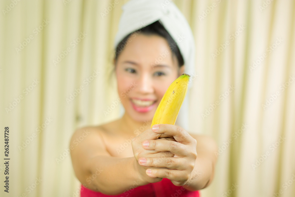 woman holding banana acting smile, sad, funny, wear a skirt to cover her breast after wash hair, Wrapped in Towels After Shower woman holding banana acting smile, sad, funny, wear a skirt to cover her breast after wash hair, Wrapped in Towels After Shower