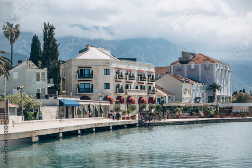 Beautiful view of the architecture of the coastal city of Tivat in Montenegro against the backdrop of the sea and mountains.