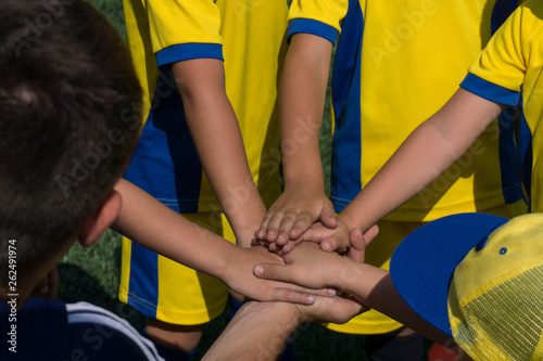 children's men's soccer team get ready for the game and is charged with fighting spirit during a general handshake on the field