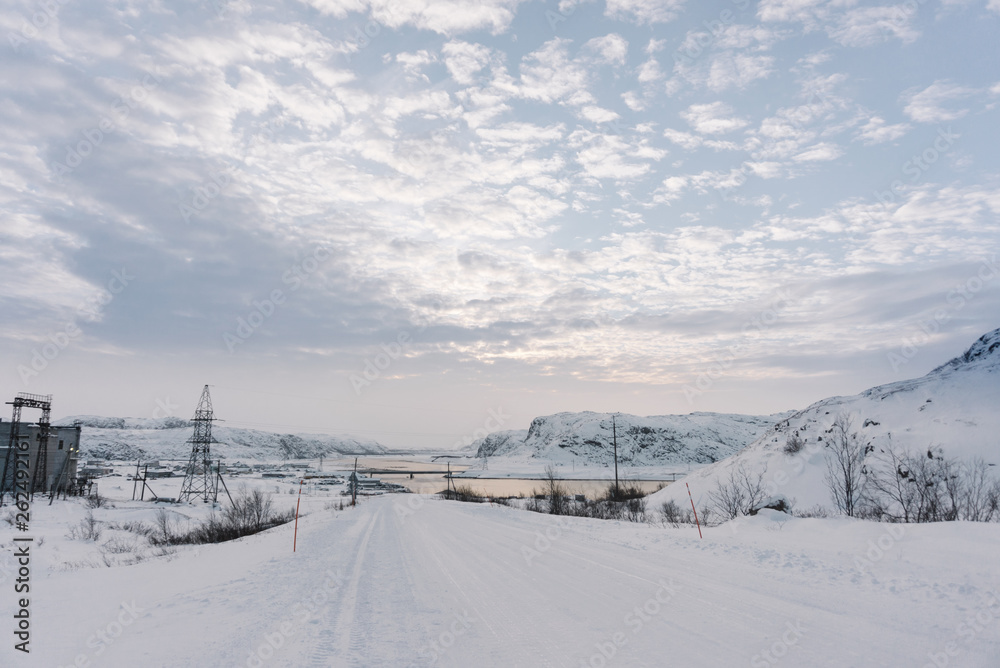 view of the village beyond the Arctic Circle in winter under a thick layer of snow more in extreme cold