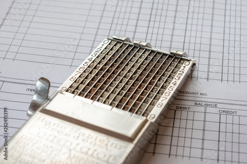 vintage adding machine on ledger accounting page