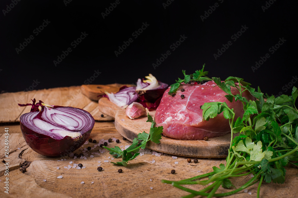 Tasty raw pork with onion and parsley. Tasty raw pork with onion and parsley.