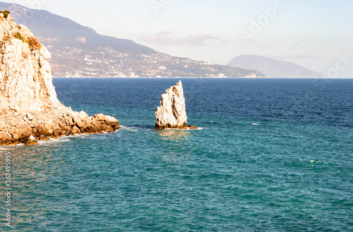 Aerial photo of Parus Sail rock and Ayu-Dag Bear Mountain and near Gaspra, Yalta, Crimea, Russia at bright sunny day over the Black sea. photo