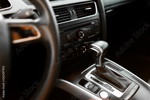 Luxury car steering wheel and dashboard with monitor. © VAKSMANV