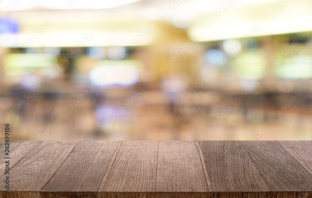Empty dark wooden table in front of abstract blurred bokeh background of restaurant . can be used for display or montage your products.Mock up for space. Empty dark wooden table in front of abstract blurred bokeh background of restaurant . can be used for display or montage your products.Mock up for space.