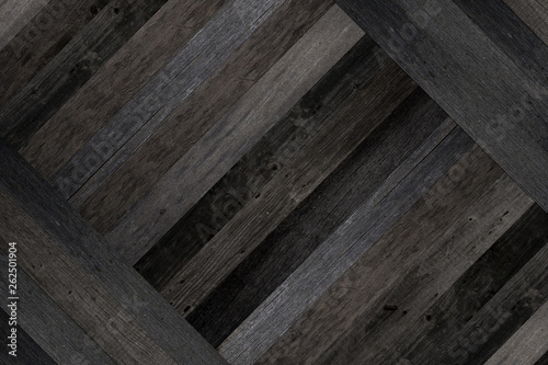 Texture of old wooden boards for background. Dark grunge parquet flooring made from barn boards.