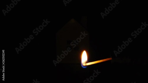 slow motion of arsonist igniting the gasoline around a house concept of house safety and insurance