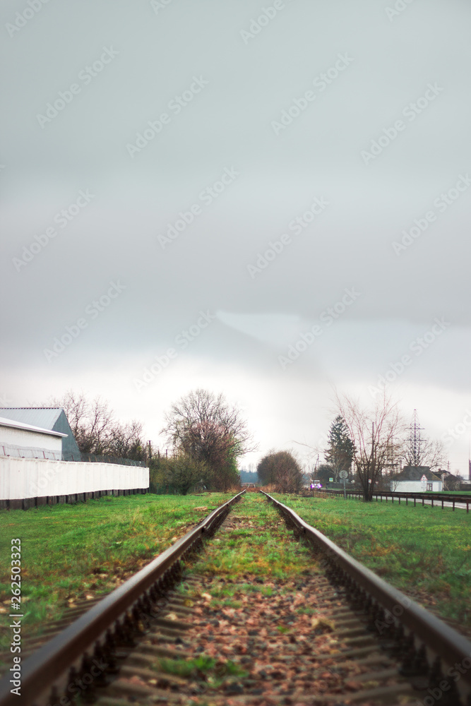 Fototapeta premium railway track leaving into the distance