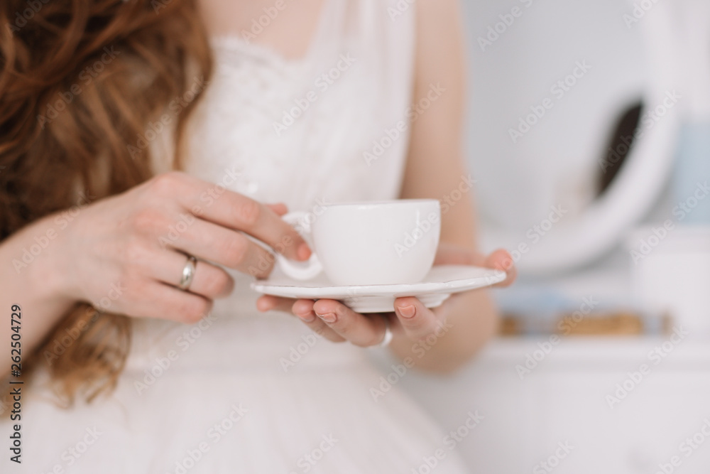 Girl with a cup of coffee. Romantic breakfast. Morning of the bride. Concept of holiday, birthday, Easter, March 8 Girl with a cup of coffee. Romantic breakfast. Morning of the bride. Concept of holiday, birthday, Easter, March 8