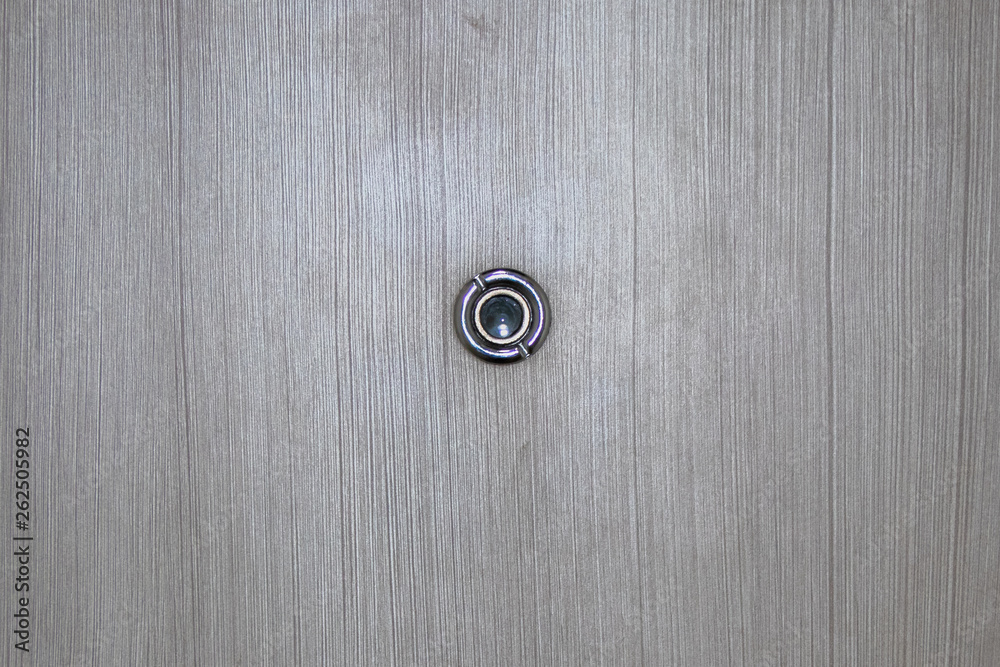 Peephole on wooden door. Peephole on wooden door.