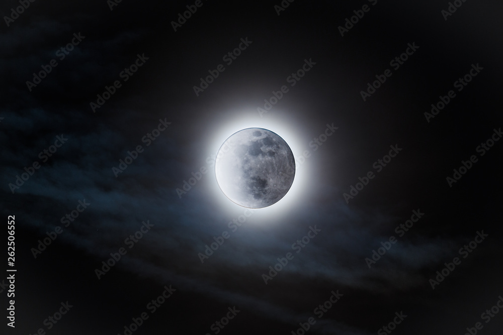 Full moon with the sun's glow behind it Full moon with the sun's glow behind it