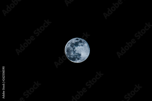 Simple full moon on the dark night sky