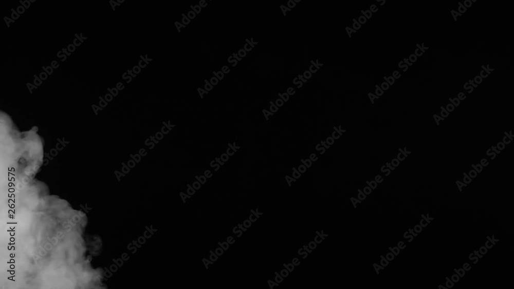 White smoke on black background in slow motion. White smoke on black background in slow motion.