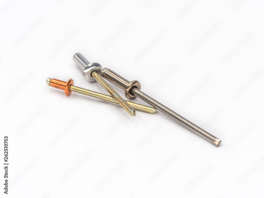 Mixed flat pop rivets with mixed mandrels on white. Mixed flat pop rivets with mixed mandrels on white.