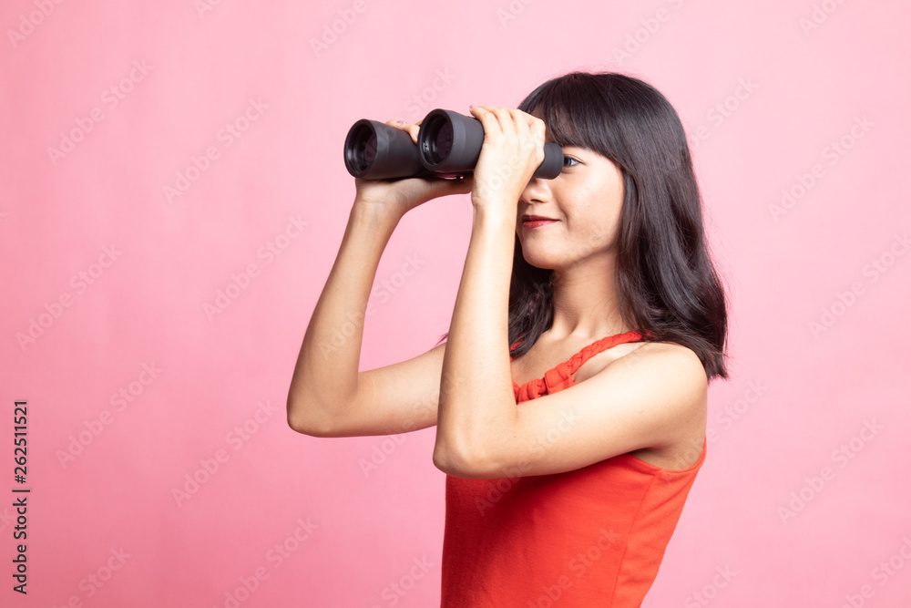 Young Asian woman with binoculars. Young Asian woman with binoculars.