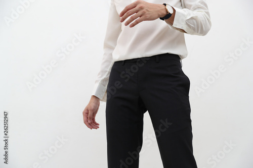 close-up of A handsome man in white V-neck shirt and black long trousers.