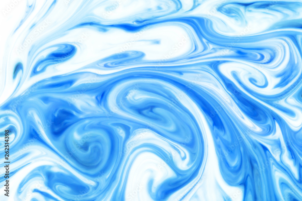 Blue and white paint pigment mix. Ornament mosaic swirl shapes background.