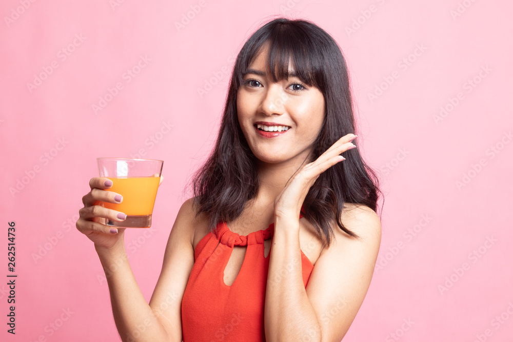 Happy Young Asian woman drink orange juice. Happy Young Asian woman drink orange juice.