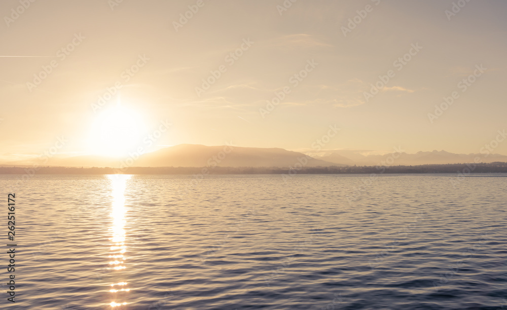 Fototapeta premium A beautiful sunrise over a lake that motivates you to work.