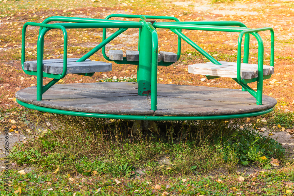 Circular swings for riding small children in playground. Circular swings for riding small children in playground.