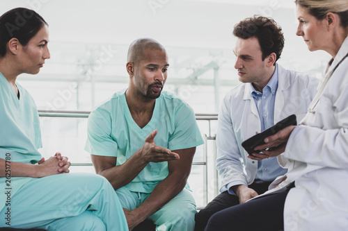 African American medical professional discussing patient treatment in a hospital photo