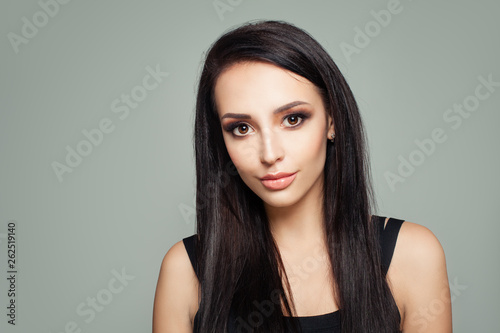 Portrait of brunette woman with straight hair