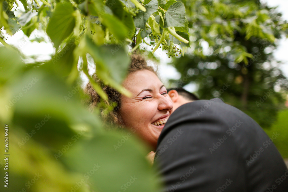 Beautiful wedding couple posing in park Beautiful wedding couple posing in park