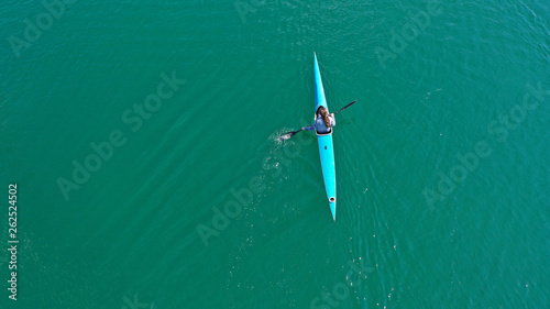 Aerial drone photo of women competing in sport canoe in calm water lake