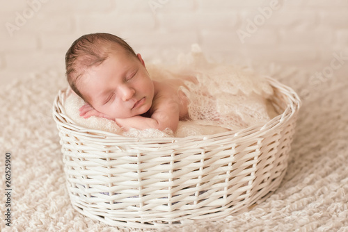Newborn baby sleeping in a beautiful pose