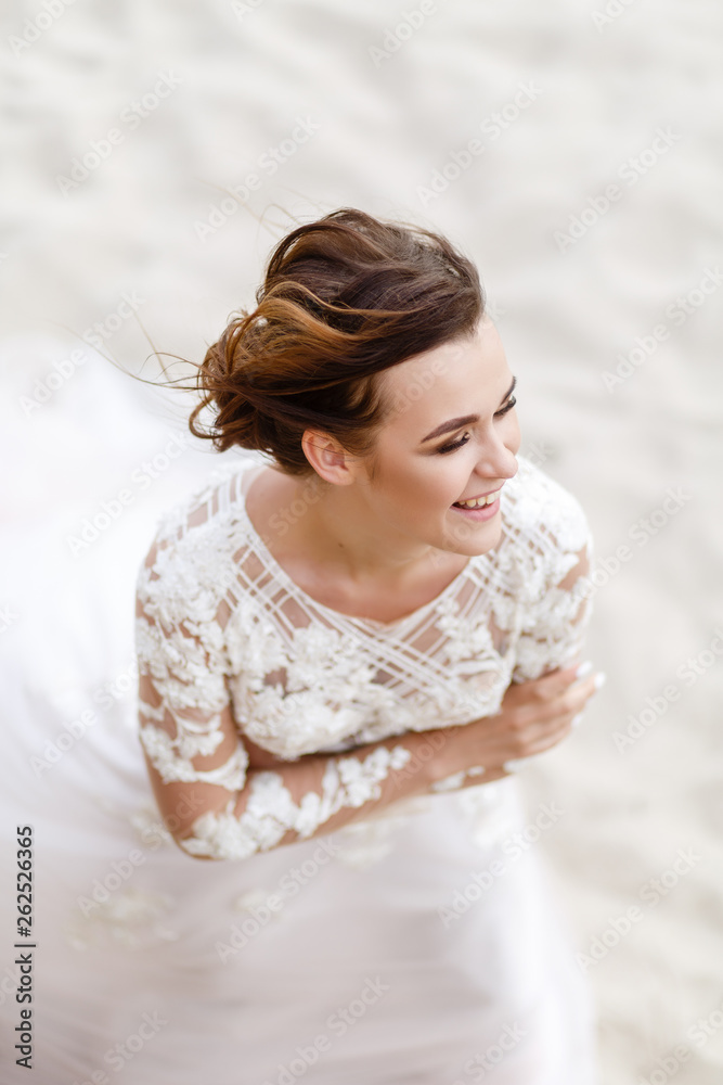 portrait of the bride on the background of the sea in windy weather portrait of the bride on the background of the sea in windy weather