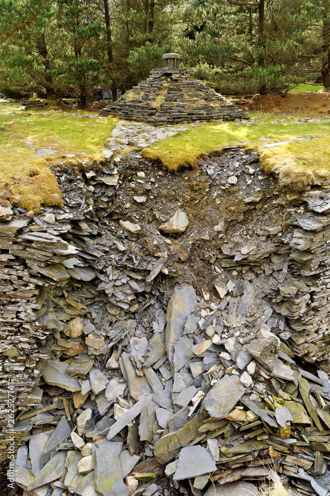 Stream trough reinforced by rocks on the Cwmorthin Waterfall trail in the mountains of Snowdonia National Park, Wales. Stream trough reinforced by rocks on the Cwmorthin Waterfall trail in the mountains of Snowdonia National Park, Wales.