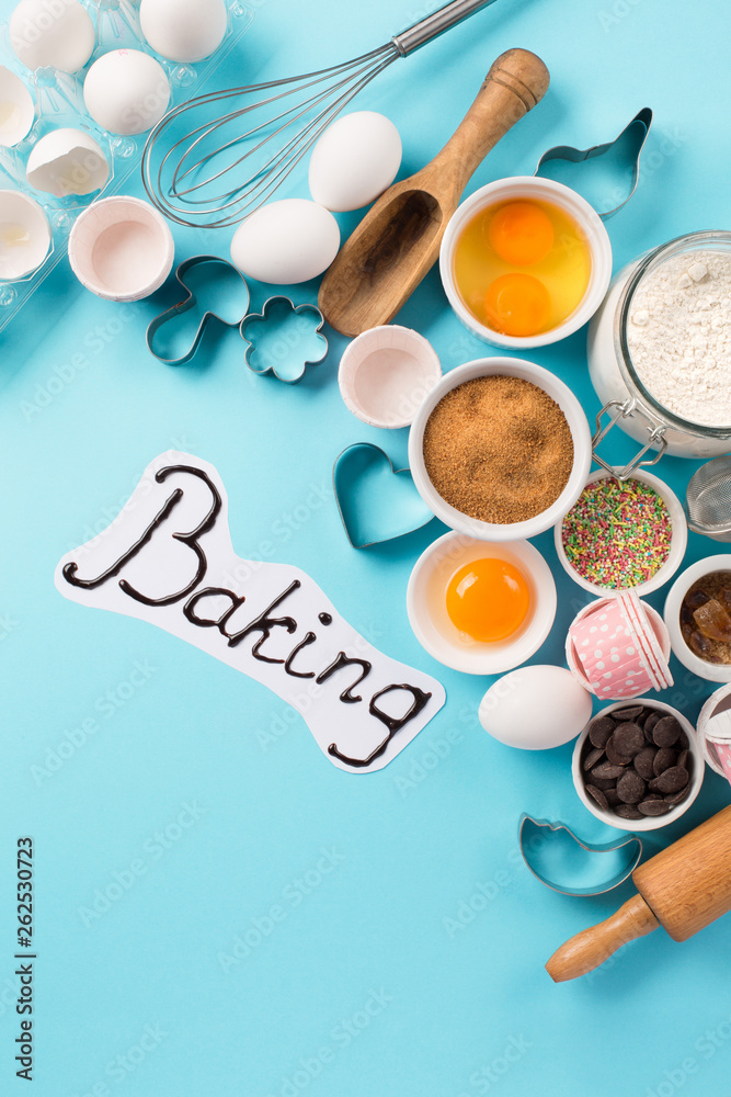Ingredients and utensils for baking, blue background Ingredients and utensils for baking, blue background