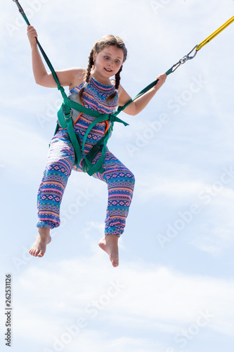 a young girl on the trampoline