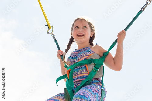 a young girl on the trampoline