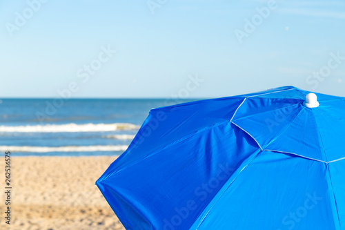 Parasol on the beach in a sunny day of summer. © AlexPhotoStock