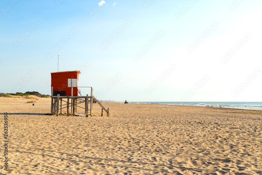 Beach scene. Beautiful morning of summer. The sun bright over the sea. Mar de las Pampas. Argentina.