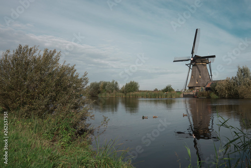 mill in Unesco place Kinderdijk, The Netherlands, along river Alblas