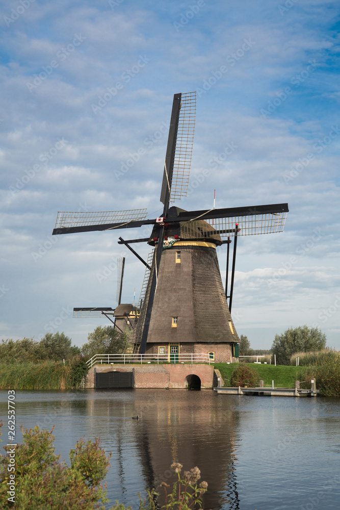 mill in Unesco place Kinderdijk. The Netherlands, along river Alblas