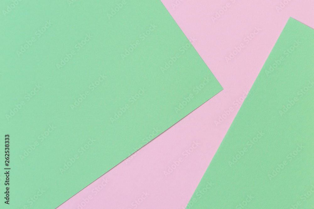 Pastel color paper background. Pink and green color layout composition