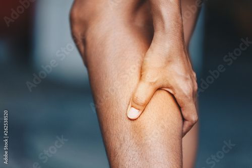 young woman from calf pain, Health care concept photo