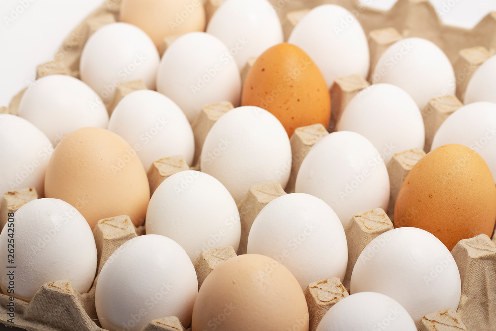 Raw eggs lie in shape on a white background Raw eggs lie in shape on a white background