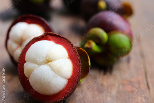 Selective focus Mangoesteen Asian fruit raw food and good ingredient on wooden background   photo