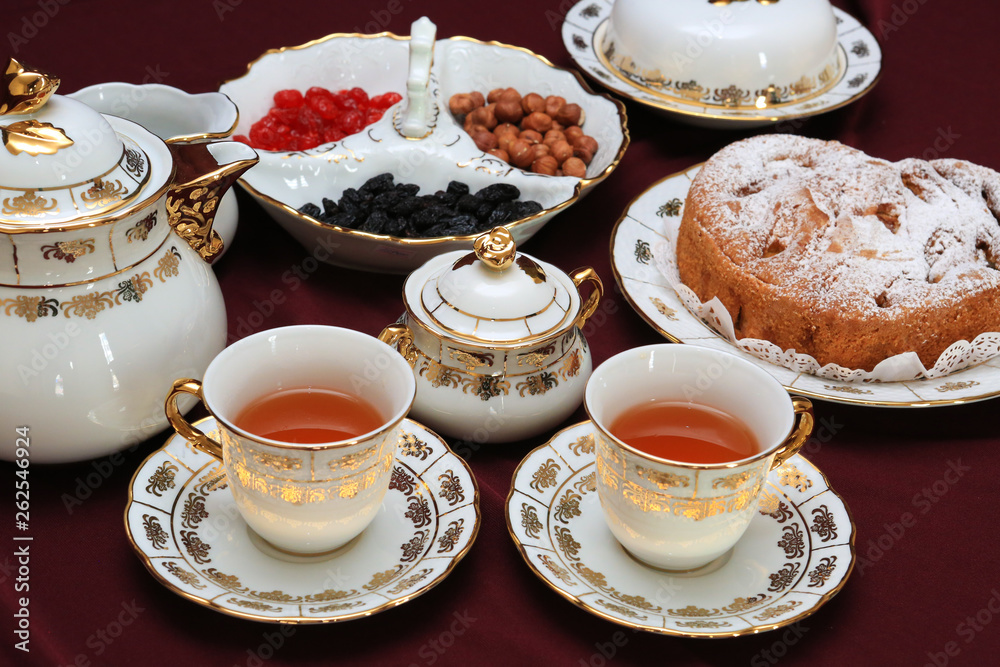 cup of tea and cakes on plate cup of tea and cakes on plate
