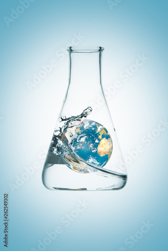 3D rendering of planet Earth under a wave inside a flask