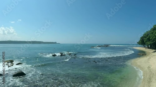 Sea waves depart from the coast - Panorama, Camera rotation. Indian Ocean, Hikkaduwa; Sri Lanka photo