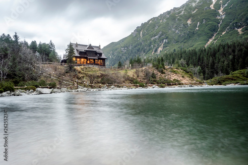Fototapeta Naklejka Na Ścianę i Meble -  Warm wooden shelter by Morskie Oko Lake in Tatra Mountains, Poland