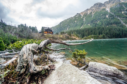 Fototapeta Naklejka Na Ścianę i Meble -  Warm wooden shelter by Morskie Oko Lake in Tatra Mountains, Poland