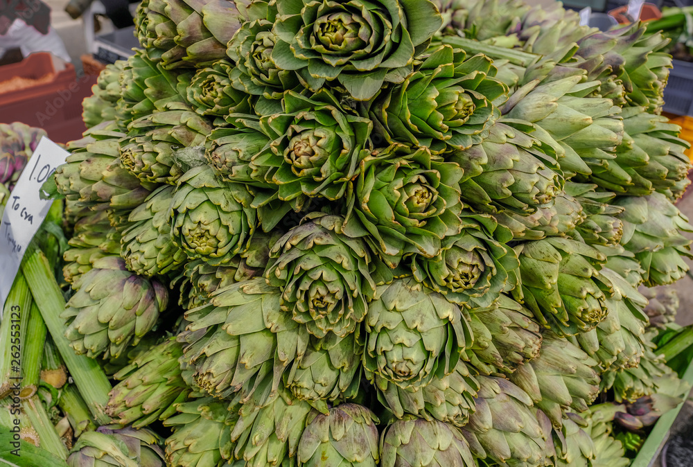 Fototapeta premium Display of artichoke's on sale at a market stall.